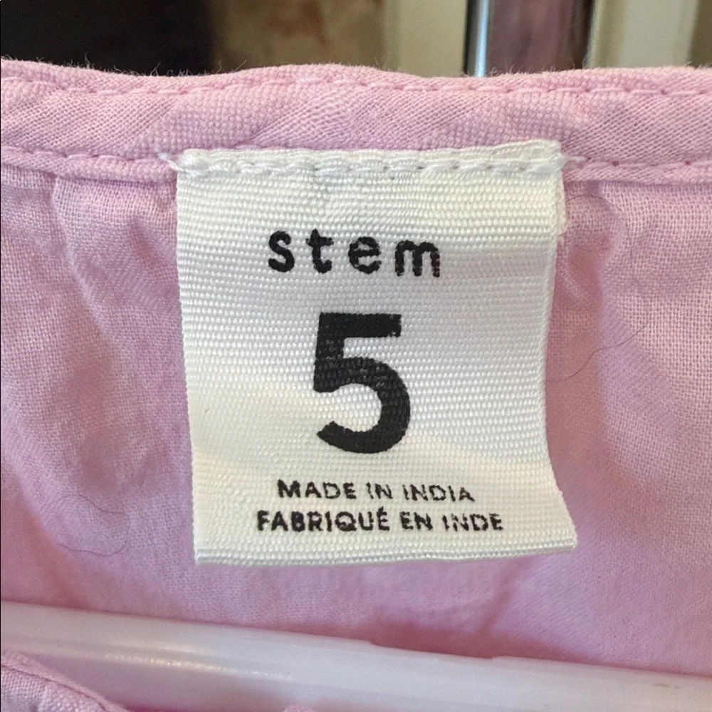 Pink textured seersucker dress is from the brand stem.Size 5